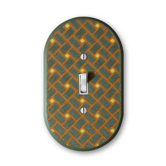 Lellume Mid Century Collection #3 light switch plate with a green and orange geometric pattern